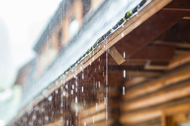 Roof with rain falling on it viewed from below, illustrating local search success by Elev Marketing in Omaha
