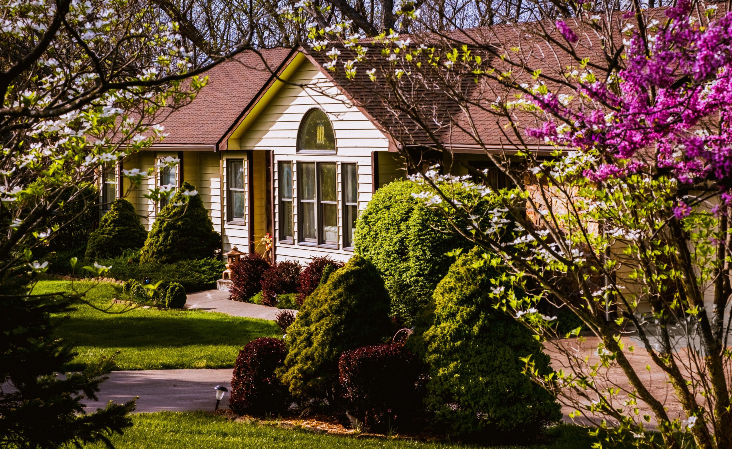 Beautiful residential home with lush garden and landscaping showcasing SEO strategy case study by Elevation Marketing.