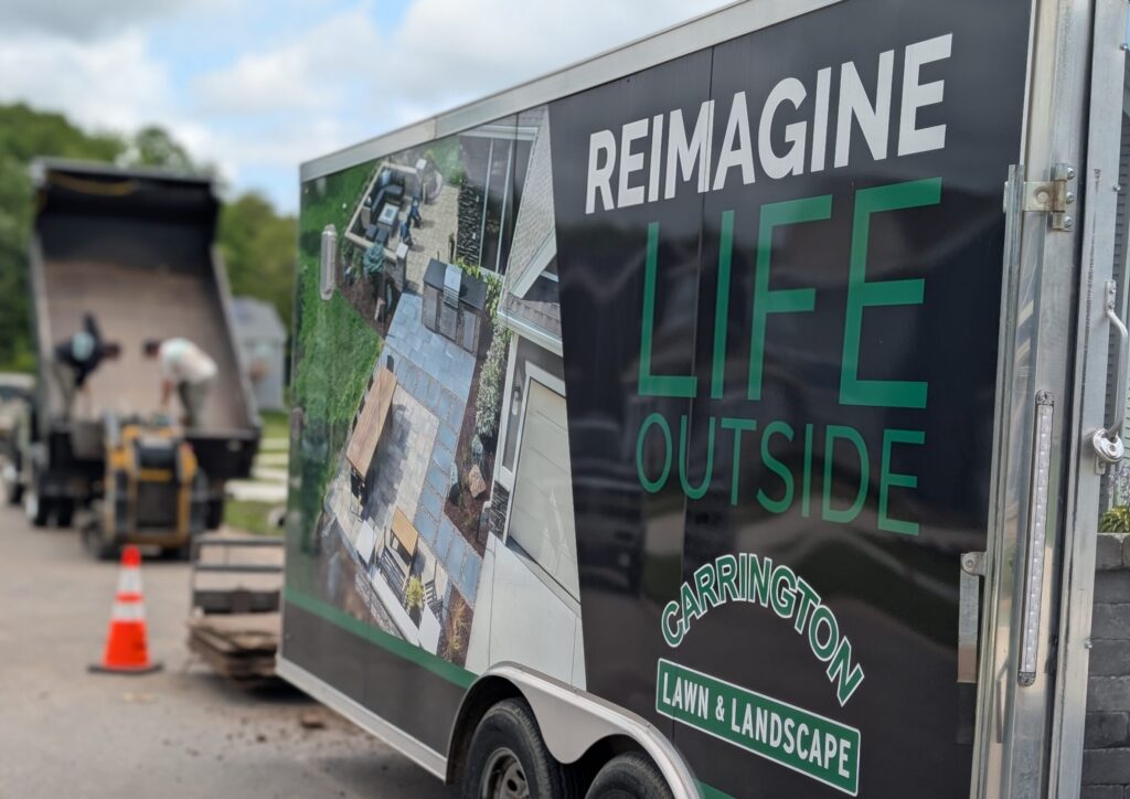 landscape trailor showing carrington lawn & landscape logo