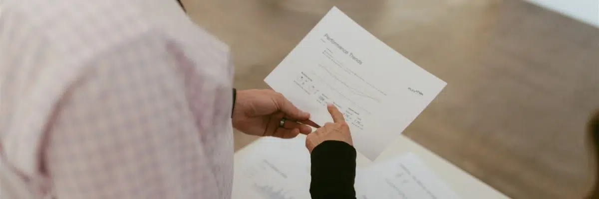 Marketing professionals reviewing contractor SEO performance reports by Elevation Marketing™