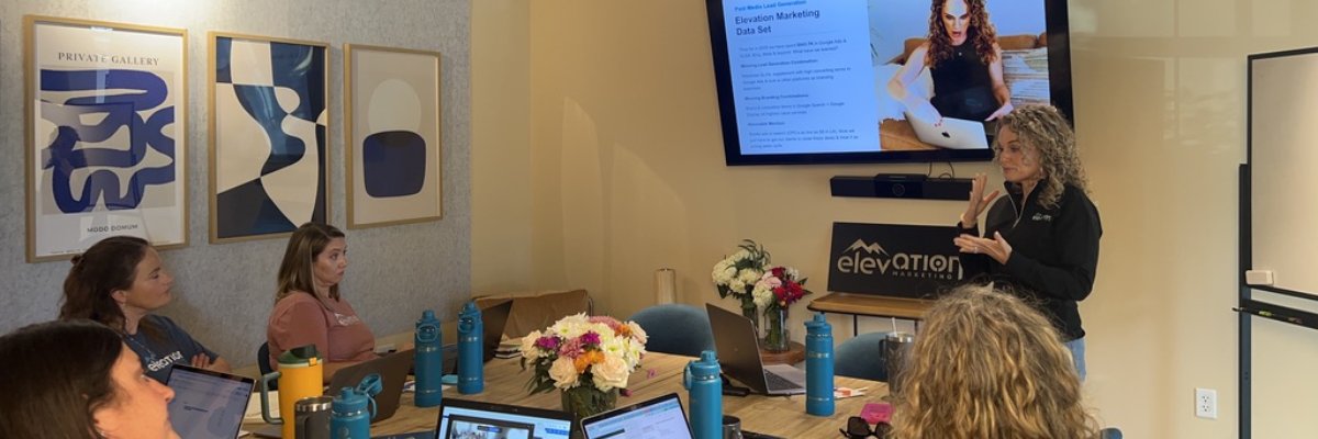 Professional creating a content marketing strategy on a laptop by Elevation Marketing™