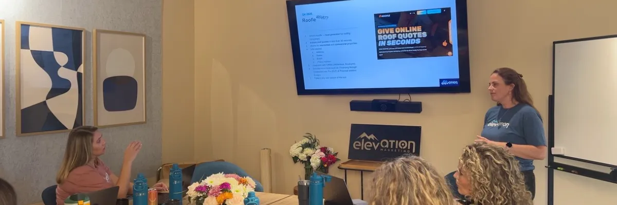 Marketing professional reviewing instant roof quote analytics dashboard by Elevation Marketing™
