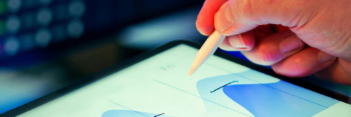 A hand using a stylus on a tablet with a digital data chart, representing AI visibility, analytics, and search performance.