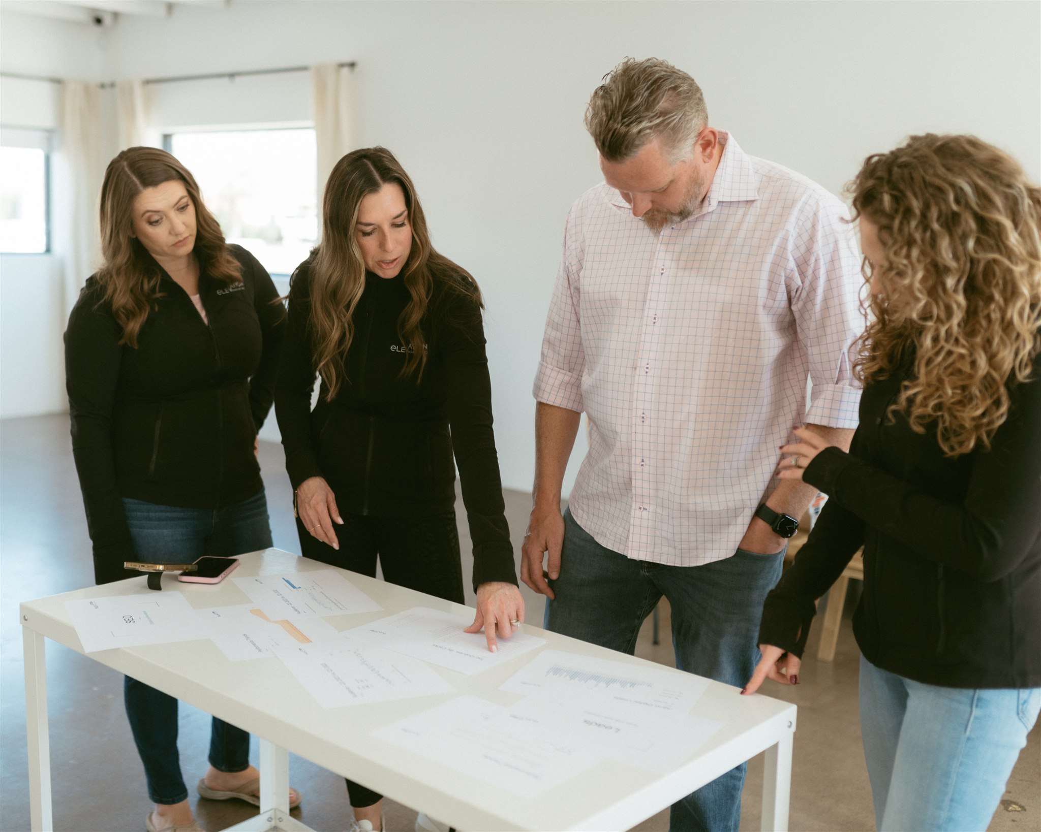A team collaborates on a strategic marketing blueprint to understand fractional CMO for contractors fractional CMO services in Denver by Elevation Marketing